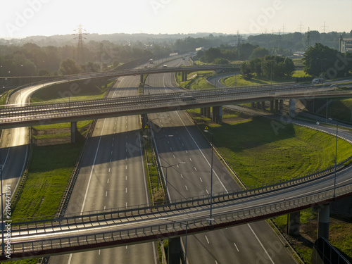 Aerial view of multilayer highway interchange at sunrise