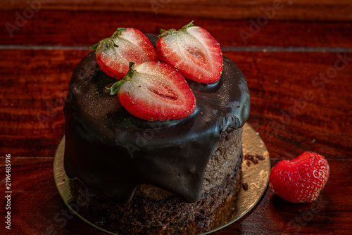 Chocolate strawberry fruit dark brown cake wooden table