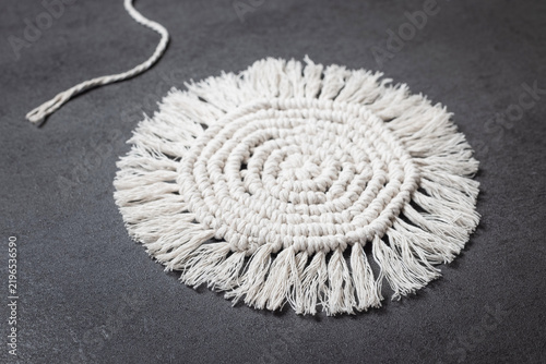 Konstfotografi White macrame decorative item with fringe details, finished handicraft