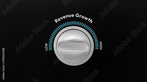 Business revenue growth concept with dial knob turning from low to high progress with black isolated backdrop