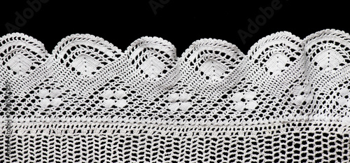 Crochet lace patterns border, crocheted Grandma's Doily corner, detail of hand-crocheted embroidery, tablecloth, napkin isolated on black background border art design. Craft, vintage linen. Flat lay