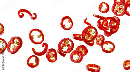 фотографія Isolated vibrant red hot chili pepper slices and pieces dynamically arranged