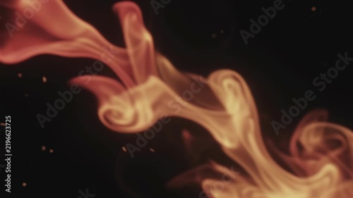 Cinematic light leak with warm smoke wisps and glowing particles