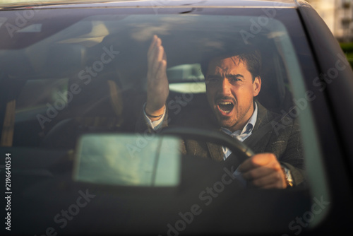 Bild auf Leinwand Man expressing road rage while driving car