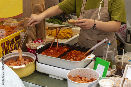 Photography Authentic Shanghai street food featuring a variety of prepared Chinese dishes at a local market stall