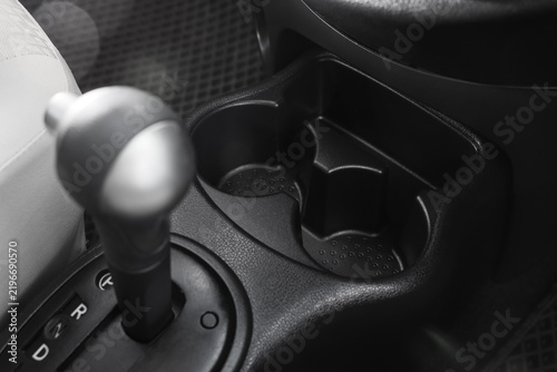 Принти на полотні Automotive convenience and car interior design, empty cup holders and gear shift
