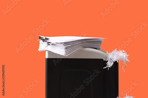 Quadro su tela Data security and document destruction, paper shredder with stack of files for i