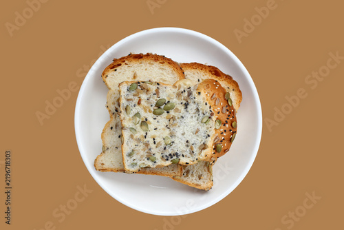 Obraz na plátne Sliced multigrain bread topped with pumpkin seeds, sunflower seeds, sesame, and black sesame