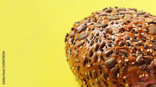 Obraz na plátne Healthy multigrain bread bun topped with mixed seeds and grains