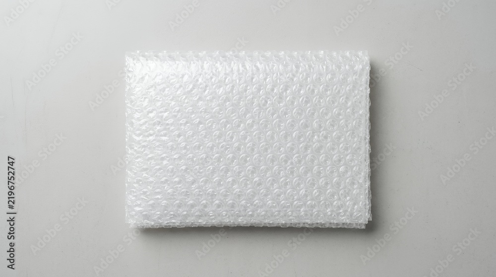 Obraz premium White textured surface with small bubbles and shadows.