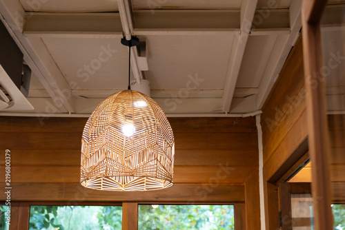 Warm glowing pendant light with natural woven texture. handmade hanging lamp.
