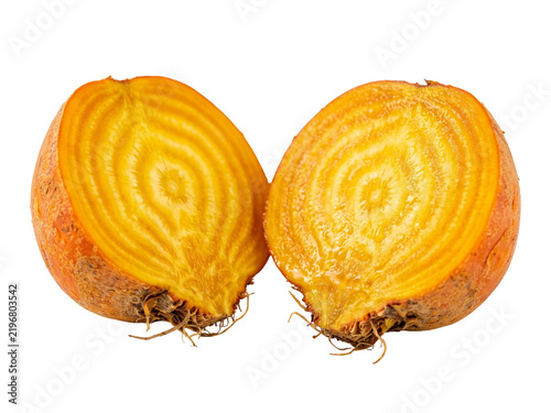 Two halves of a fresh golden beet isolated on a white background