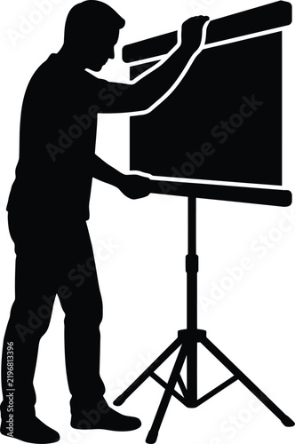 Man setting up projector screen for presentation.
