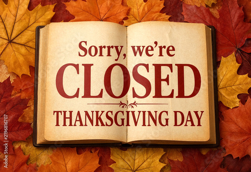 Open book showing closed sign for Thanksgiving Day celebration