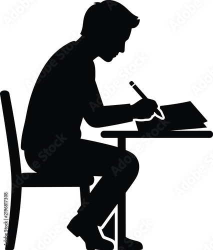 Silhouette of student writing at desk with books.