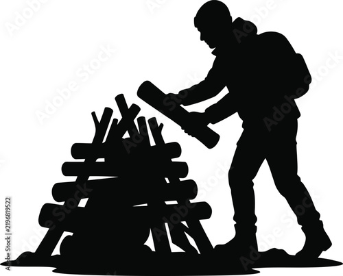 Hiker gathering firewood for campfire in wilderness, outdoor camping and survival preparation.