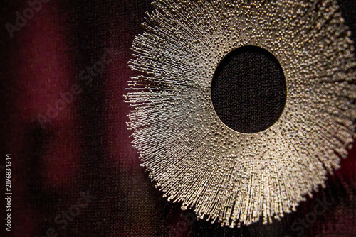Silver radial round brooch close-up jewelry display