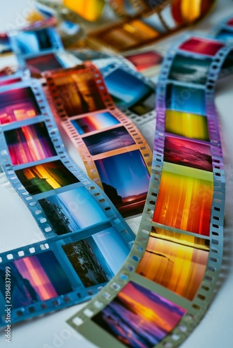 Colorful film strips showing travel and memory concepts, vertical
