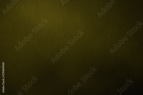 Dark grainy brass-toned abstract background with fine film noise, subtle gradient, soft glow, matte surface texture, vignette and generous copy space