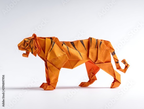 Orange Paper Tiger Origami Sculpture Standing On A Clean White Background With Soft Studio Lighting