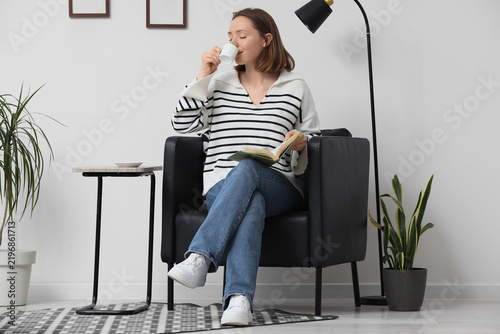 Work-life balance and mental wellness, woman relaxing with a book and coffee ...