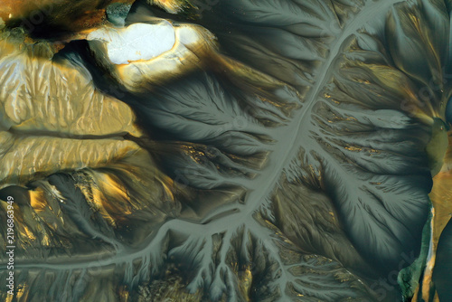 Aerial view of abstract mining pattern, nature pollution, colorful decanting lake
