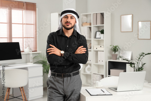 Konstfotografi Portrait of handsome Arab businessman in office