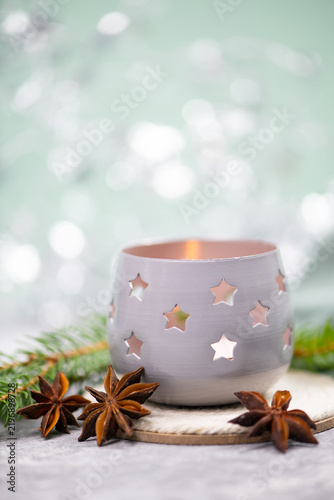 Fotografie Candle holder, tealight with stars and a burning candle light, winter christmas