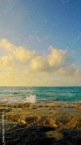 Dramatic Golden Clouds Over Calm Ocean Water During a Beautiful Day