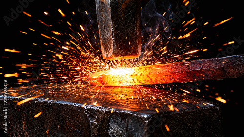 Steel forging sparks macro molten metal hammer strike orange glow blacksmith craft anvil dark background industry photography
