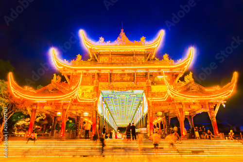 Bild auf Leinwand Frontal night view of Nanqiao Bridges ornate entrance, featuring golden illumina