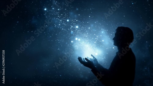 Silhouette of a man radiating radiant cosmic energy particles in deep space, concept for universal connection and inner power
