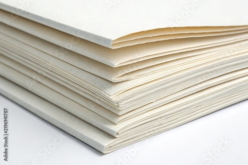 stack of folded white paper sheets closeup