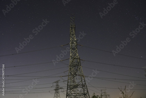 Bild auf Leinwand Power pylon starry sky electric tower