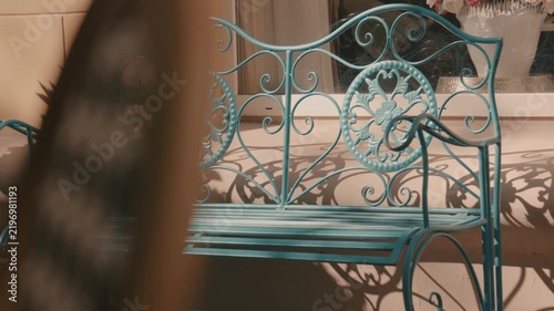 A beautiful vintage metal street bench. A beautiful element of outdoor decor.