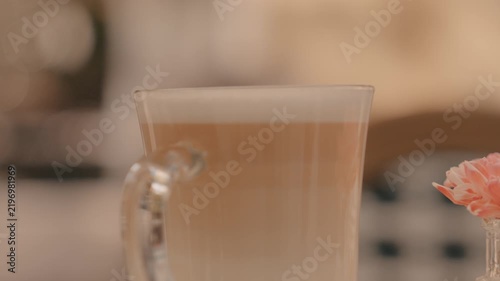Close‑up, the upper part of a glass with a drink.