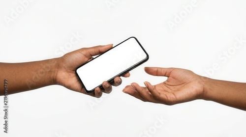 Two brown skinned women hands passing a modern smartphone with an empty white screen.