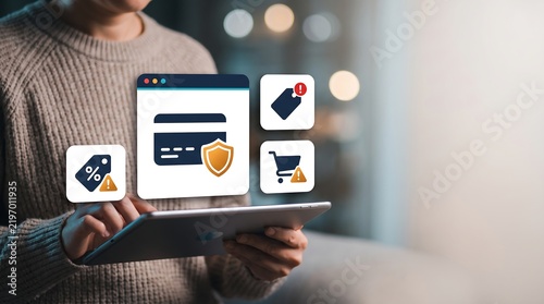 Woman holding tablet computer with holographic e-commerce icons, concept of online shopping and security.