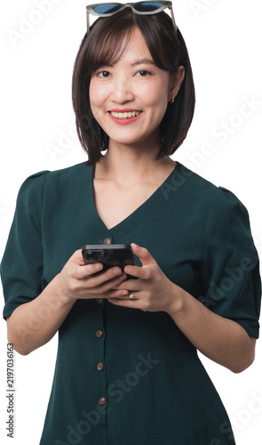 Happy asian woman holding smartphone using artificial intelligence chatbot app with joyful expression isolated on transparency background for mobile communication technology context