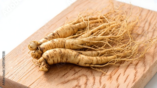 Ginseng roots on wooden board
