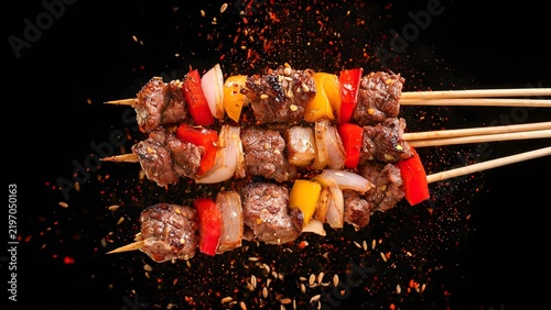 Grilled meat skewers with vegetables