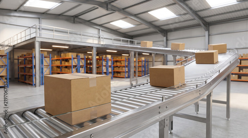 Cardboard boxes on roller conveyor belt in modern warehouse distribution center with shelves in background