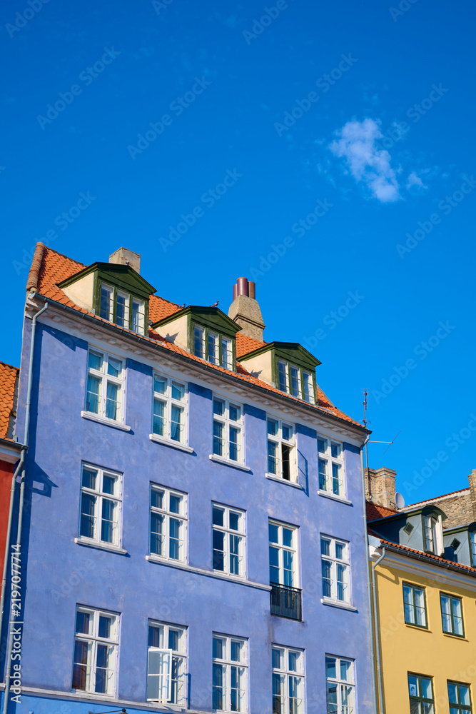 Fototapeta premium Close-up of the colorful facades of typical buildings on Nyhavn Street in Copenhagen, Denmark.