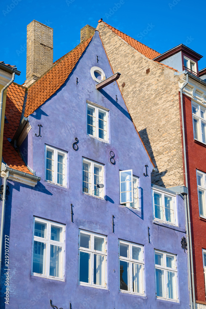 Fototapeta premium Close-up of the colorful facades of typical buildings on Nyhavn Street in Copenhagen, Denmark.
