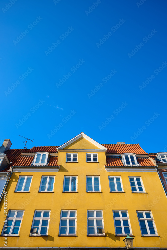 Fototapeta premium Close-up of the colorful facades of typical buildings on Nyhavn Street in Copenhagen, Denmark.