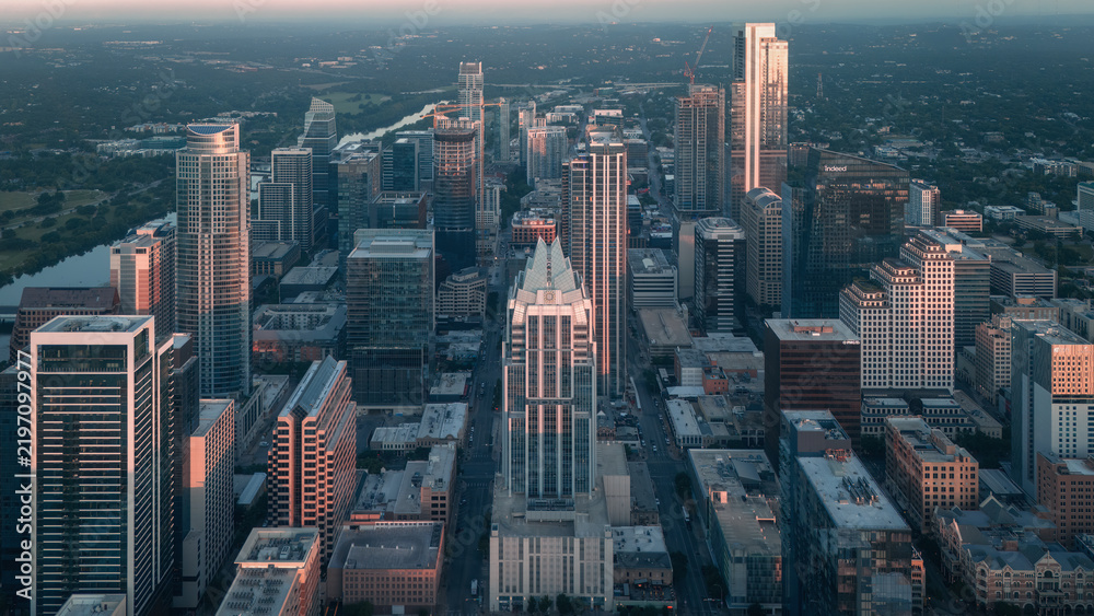 Obraz premium Aerial view of downtown Austin skyscrapers and city streets at dusk, Texas