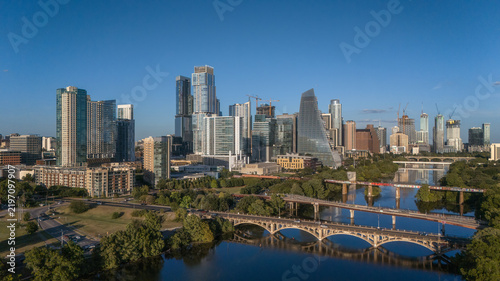 Aerial daytime view of Austin skyline with bridge over Lady Bird Lake, Texas