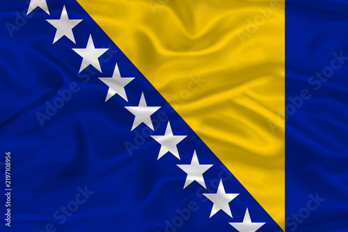 Fotografie Bosnian and Herzegovinian flag textured with fabric background