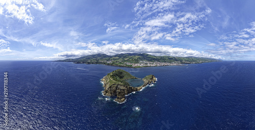Aerial view of Ilheu de Vila Franca do Campo, a volcanic islet with a circular crater lake, surrounded by the deep blue Atlantic Ocean, Vila Franca do Campo, Azores, Portugal.