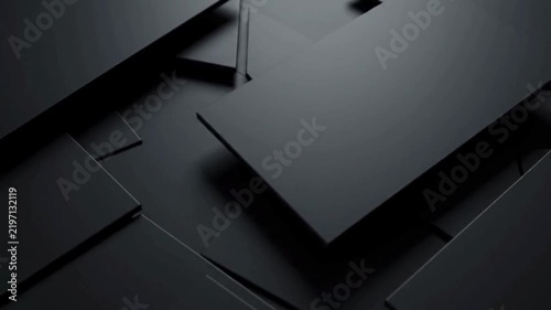 Abstract dark gray geometric shapes overlapping and casting shadows, creating a minimalist and modern background.